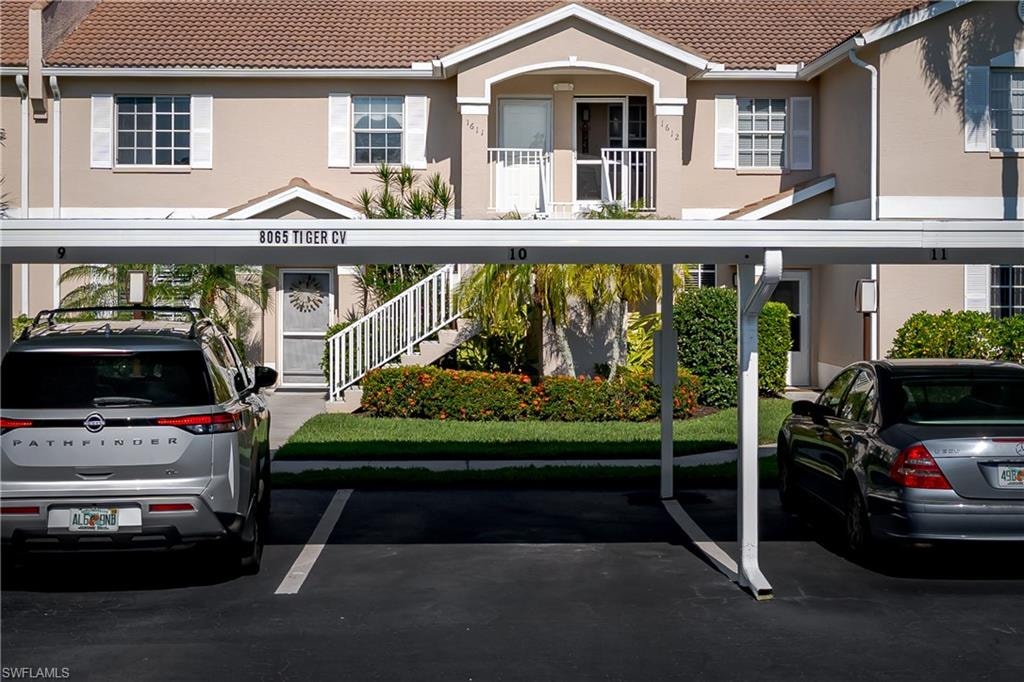 Front of condo, view of parking and front entrance