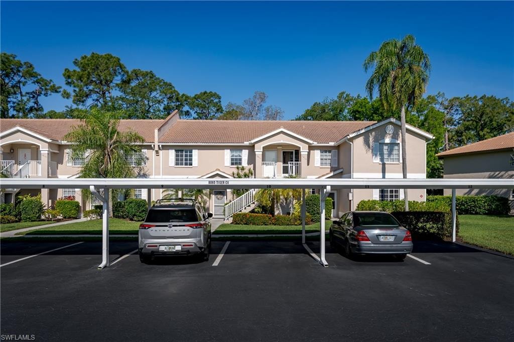 Front of condo, view of parking and front entrance