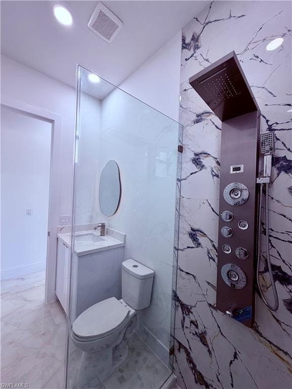 Modern full bathroom featuring a glass-enclosed shower with a multi-function panel, large format marble-look tile, recessed lighting, and a floating vanity with a vessel sink