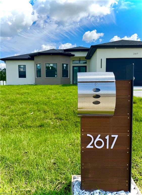 Modern exterior featuring a prominent contemporary mailbox