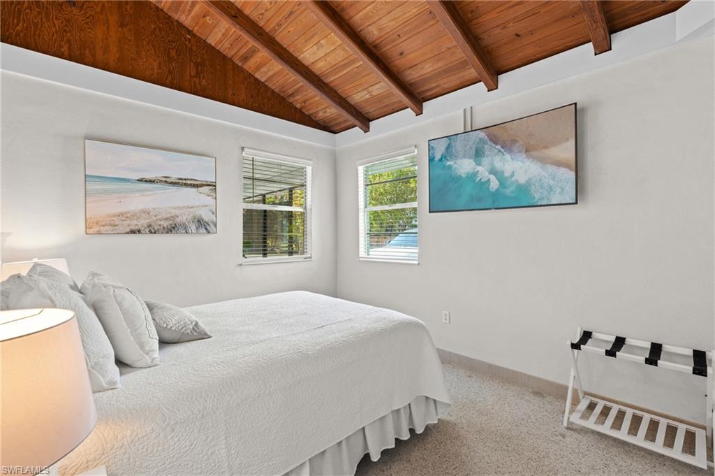 Bedroom also has vaulted ceilings and a flatscreen tv