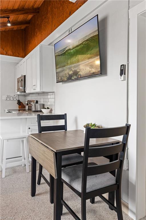 Table that opens up to a 4 top and 2 bar stools for additional seating