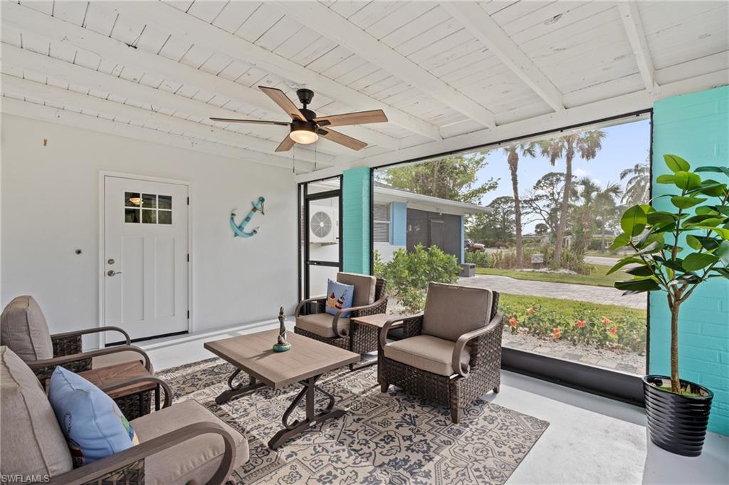 Door in enclosed porch leads to private laundry room with full size washer/dryer.