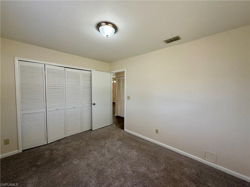 Wall-to-wall carpeting and neutral wall paint
