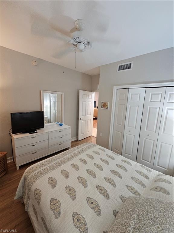 Bedroom featuring wood finished floors, a closet, and ceiling fan