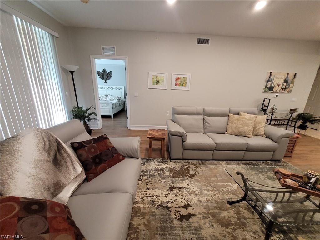 Living room featuring hardwood / wood-style flooring