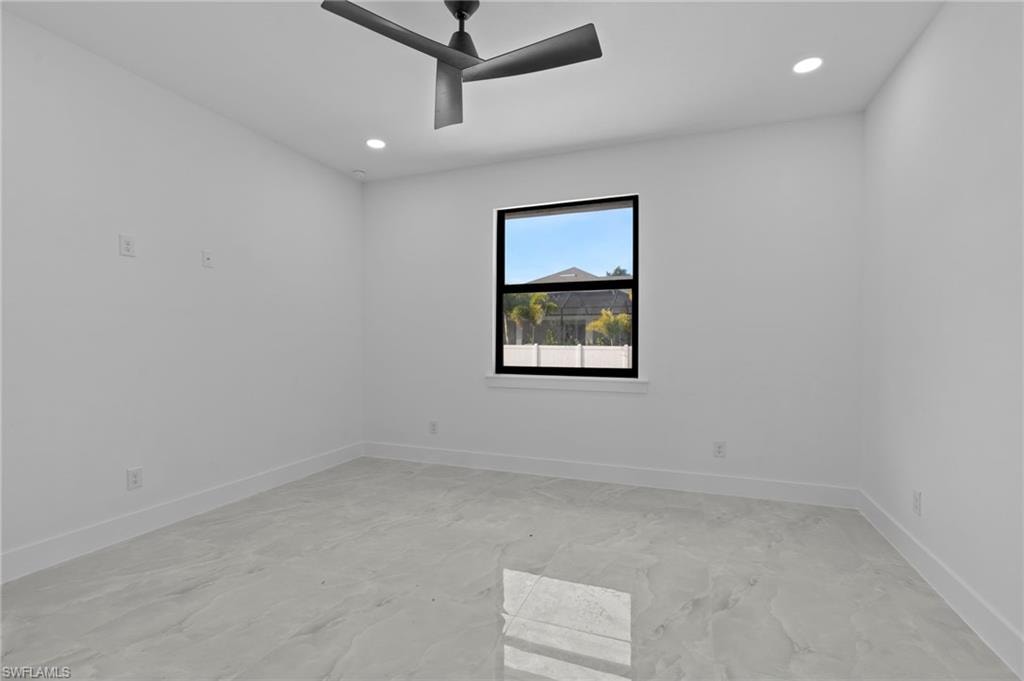 Unfurnished room featuring ceiling fan