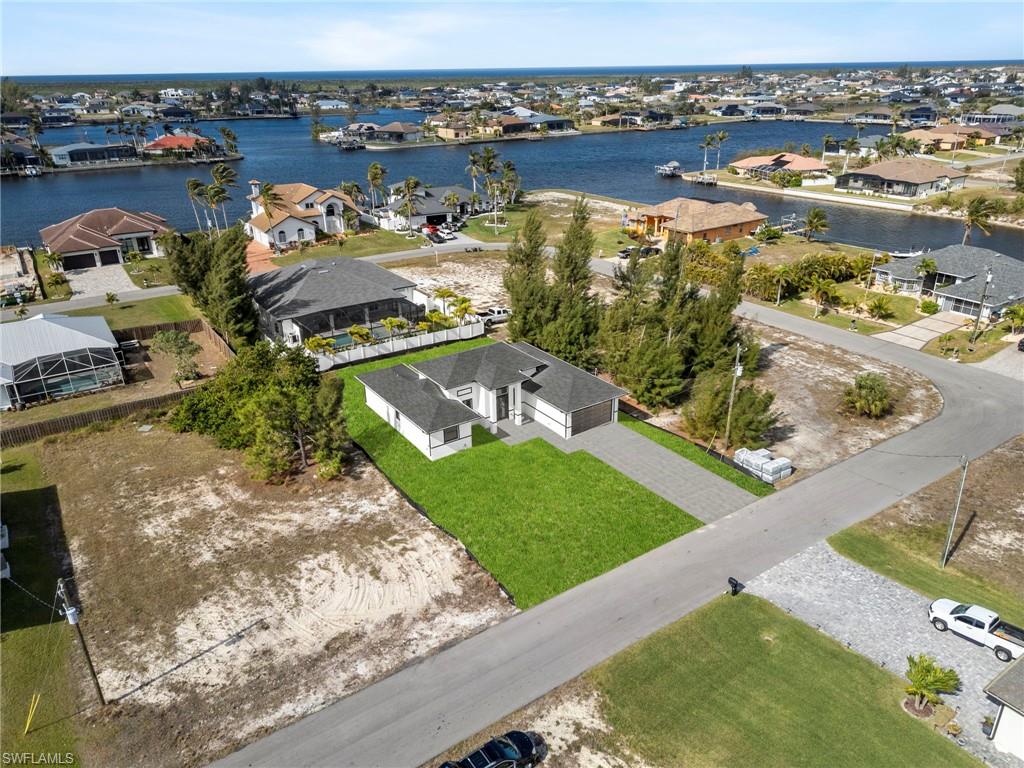 Drone / aerial view with a water view. Yard Rendered