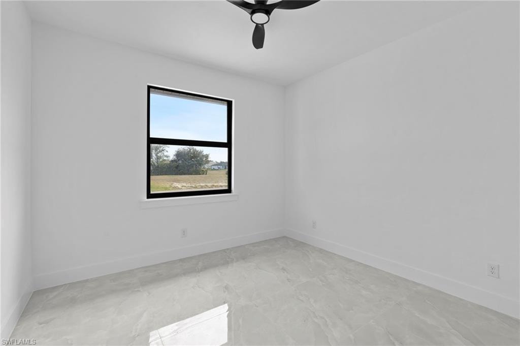 Spare room featuring ceiling fan