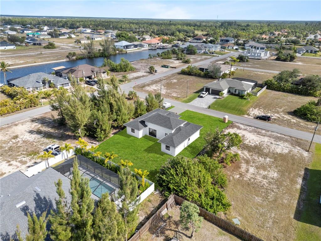 Birds eye view of property with a water view. Yard Rendered