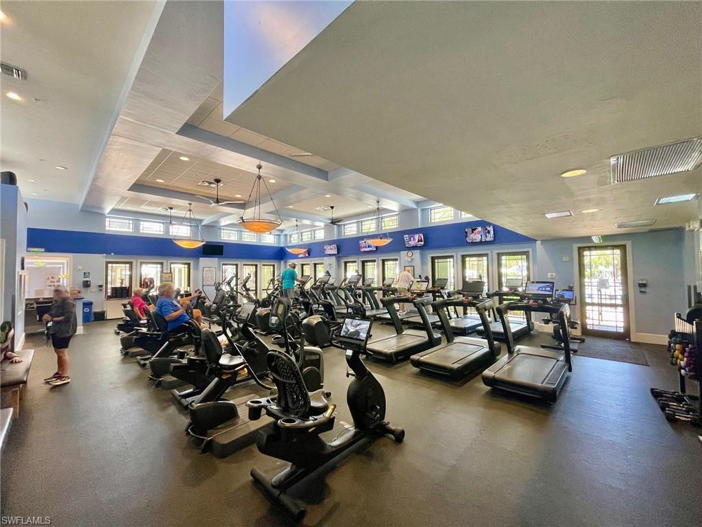 Fitness center featuring multiple exercise machines, recessed lighting, and ceiling fans