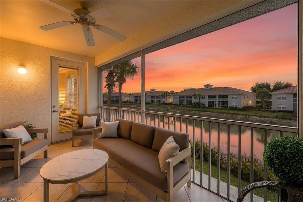 Sunroom / solarium with a water view