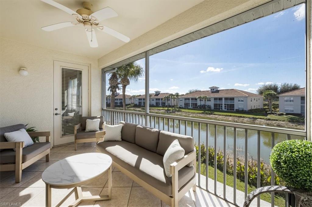 Sunroom / solarium featuring a water view, an outdoor hangout area, and a ceiling fan