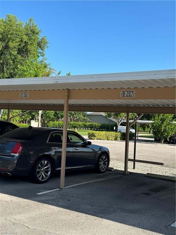 View of car parking featuring a carport