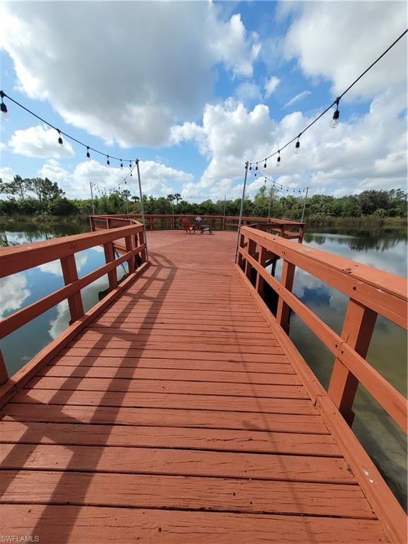View of dock with a water view