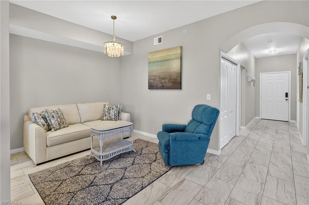 Tile flooring extending from the living area into the hallway