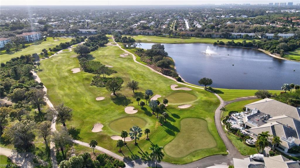 Expansive golf course featuring manicured greens and multiple sand traps