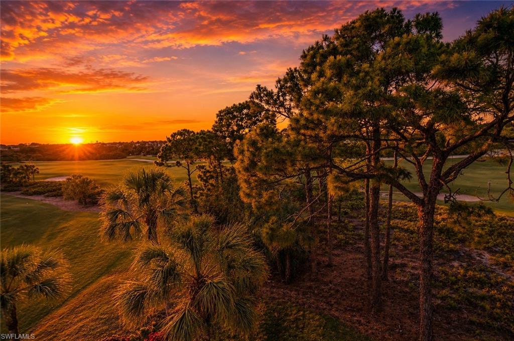 Expansive golf course landscape featuring lush green fairways and sand traps