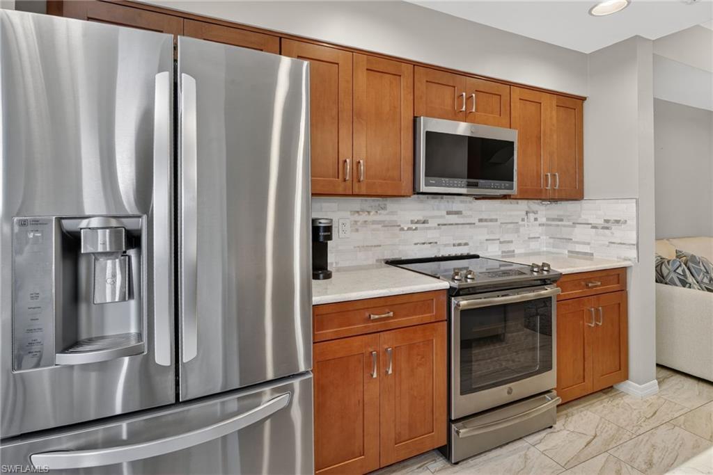 Stainless steel refrigerator with a French door design and integrated water/ice dispenser