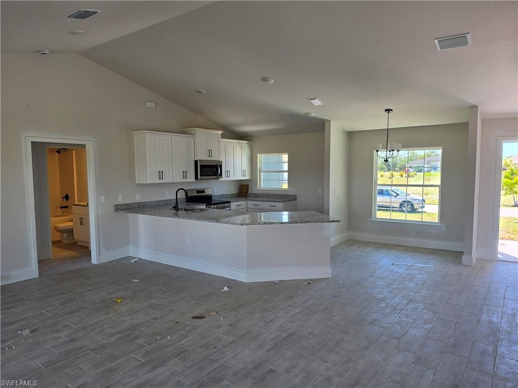 Open-concept living space with vaulted ceilings