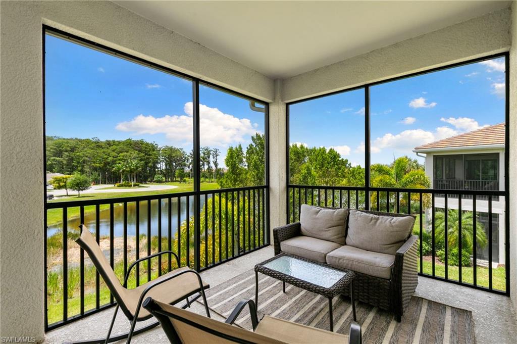 Screened lanai featuring a black metal railing