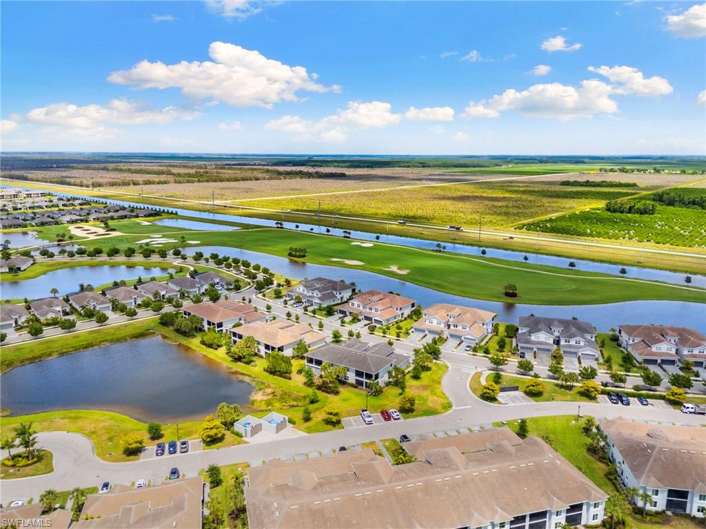 Aerial perspective showcasing a residential community with multiple single-family homes and multi-story buildings