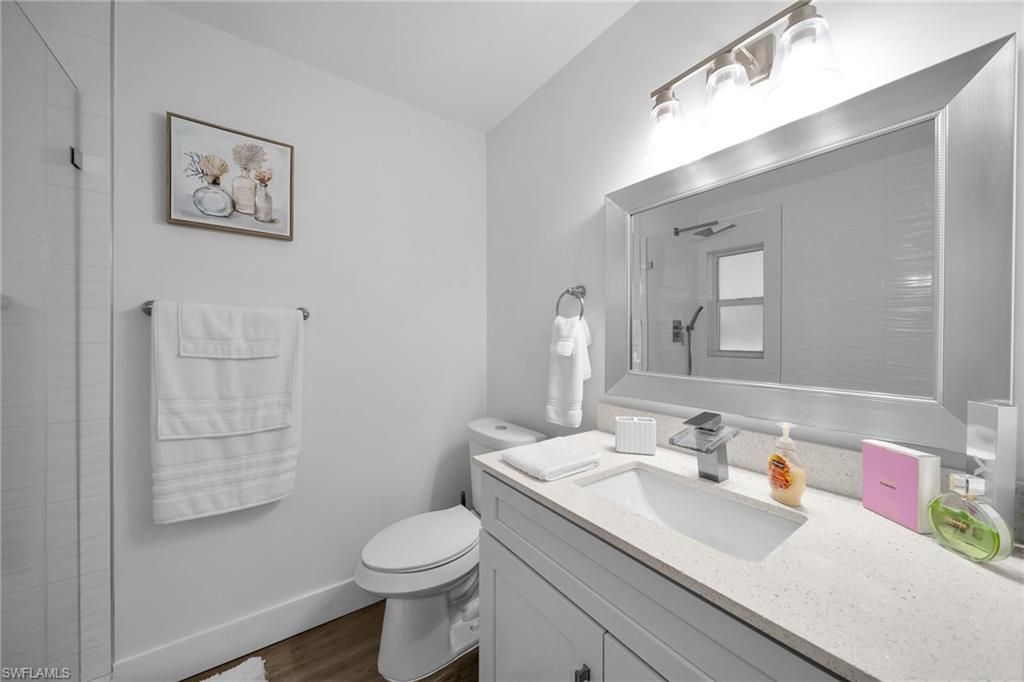 Bathroom featuring a vanity with an integrated sink, light-colored countertop, and a chrome faucet