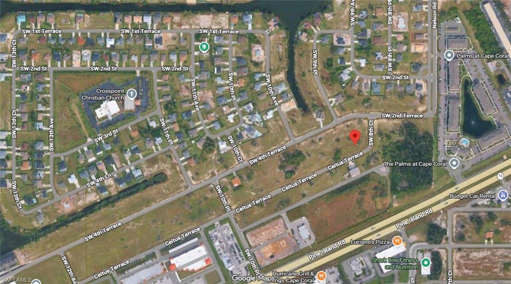 Aerial view of the 0.497-acre commercial corner site at 827 Ceitus Terrace, just off Pine Island Road. Surrounding commercial cluster visible to the south, including The Palms at Cape Coral, Budget Car Rental, Luciano's Pizza, and additional retail and service businesses along the Pine Island Road corridor.