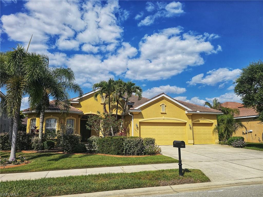 Saffron-toned stucco exterior with a tiled roof