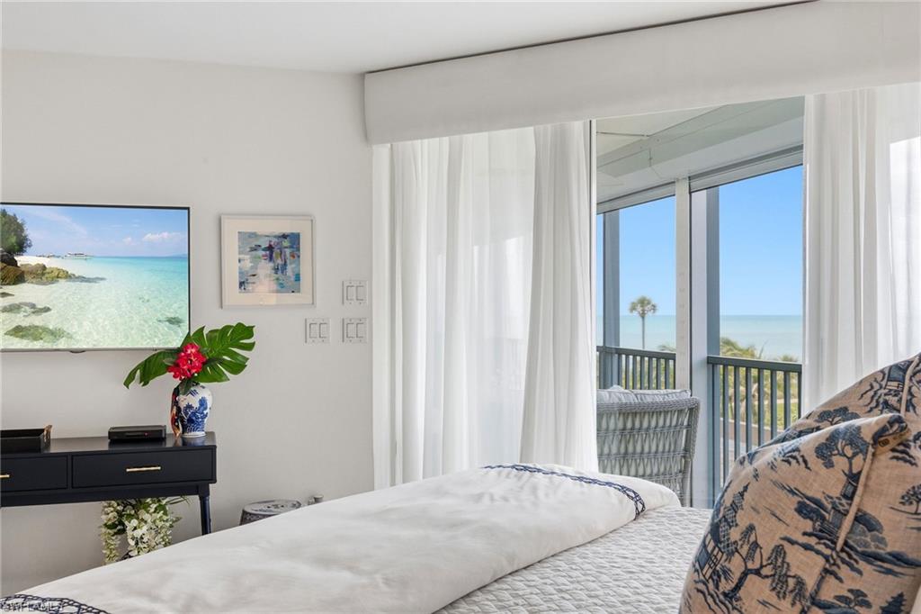 Primary bedroom with a coastal view.