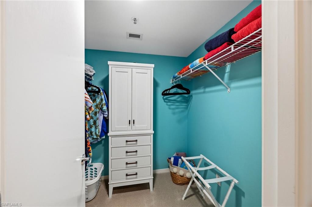 Closet in primary bedroom.