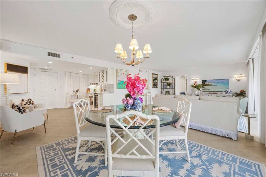 dining area with views of kitchen and living room.