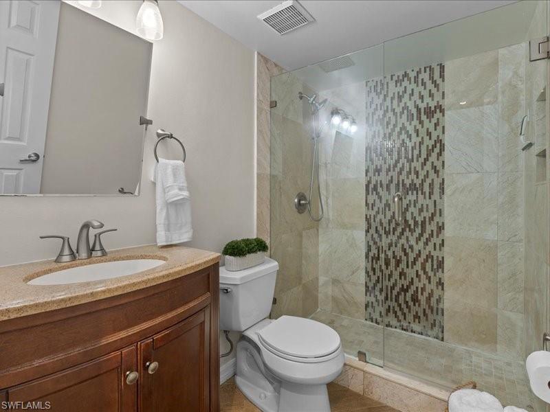 Vanity with intergrated sink, glass enclsed tile shower
