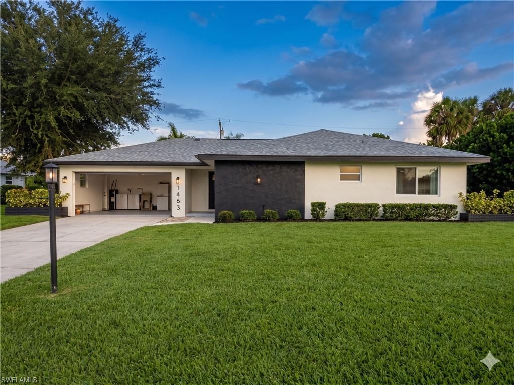 Stucco exterior with a contrasting black accent wall