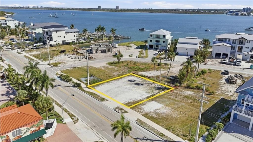 Cleared lot with direct road frontage, surrounded by established residential properties - Virtually Edited Image