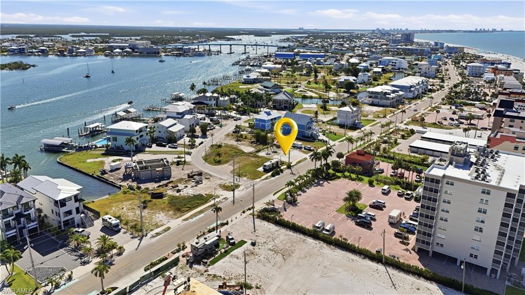 Aerial perspective featuring a waterfront setting with a vibrant blue waterway - Virtually Edited Image