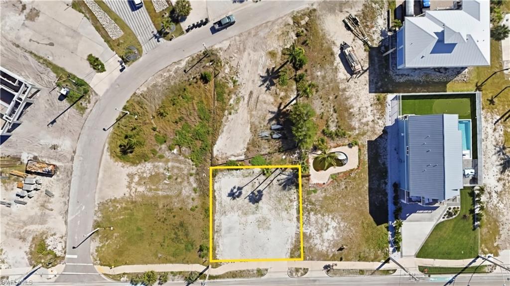 Cleared lot featuring street frontage on two sides - Virtually Edited Image