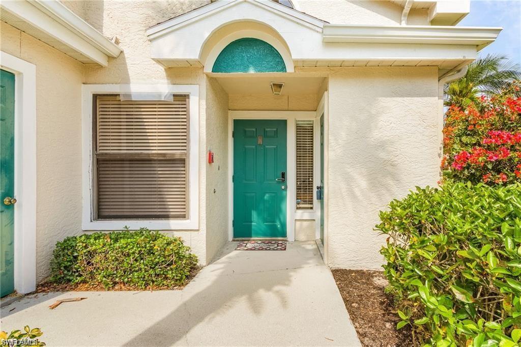 Entrance to property featuring stucco siding
