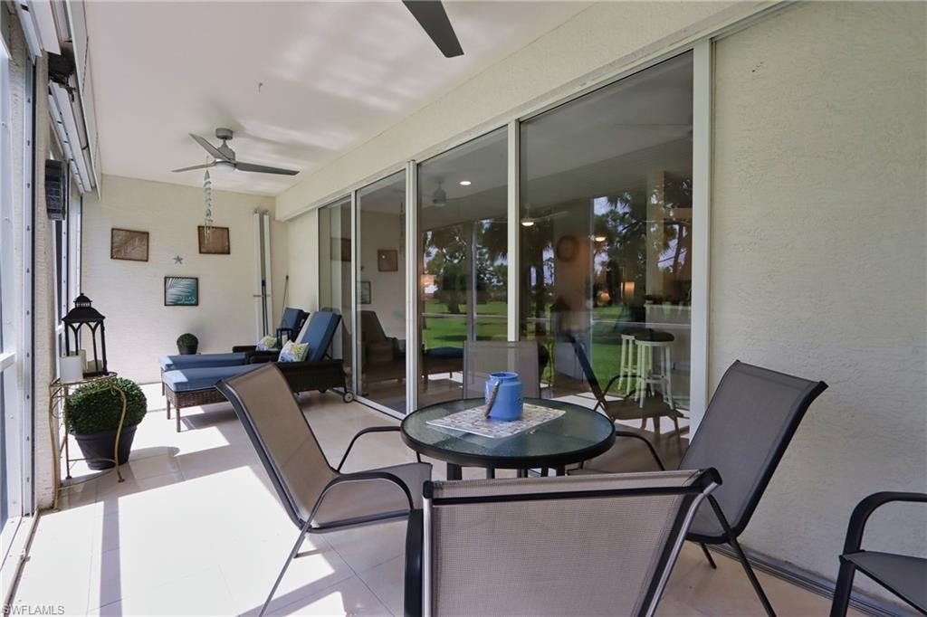Sunroom featuring ceiling fan