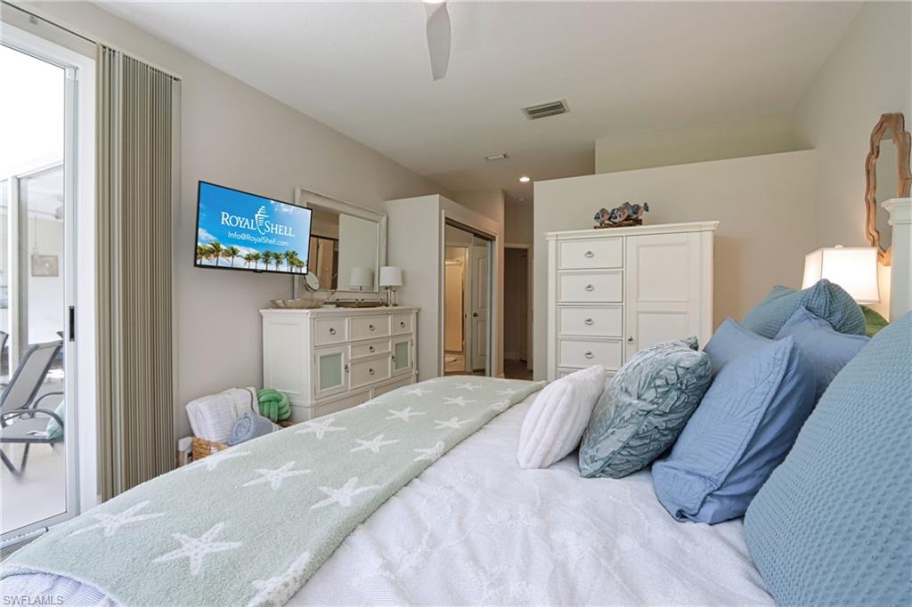 Bedroom with access to outside, a closet, and ceiling fan