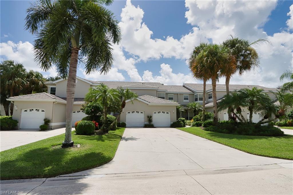 View of front of home featuring a garage and a front yard