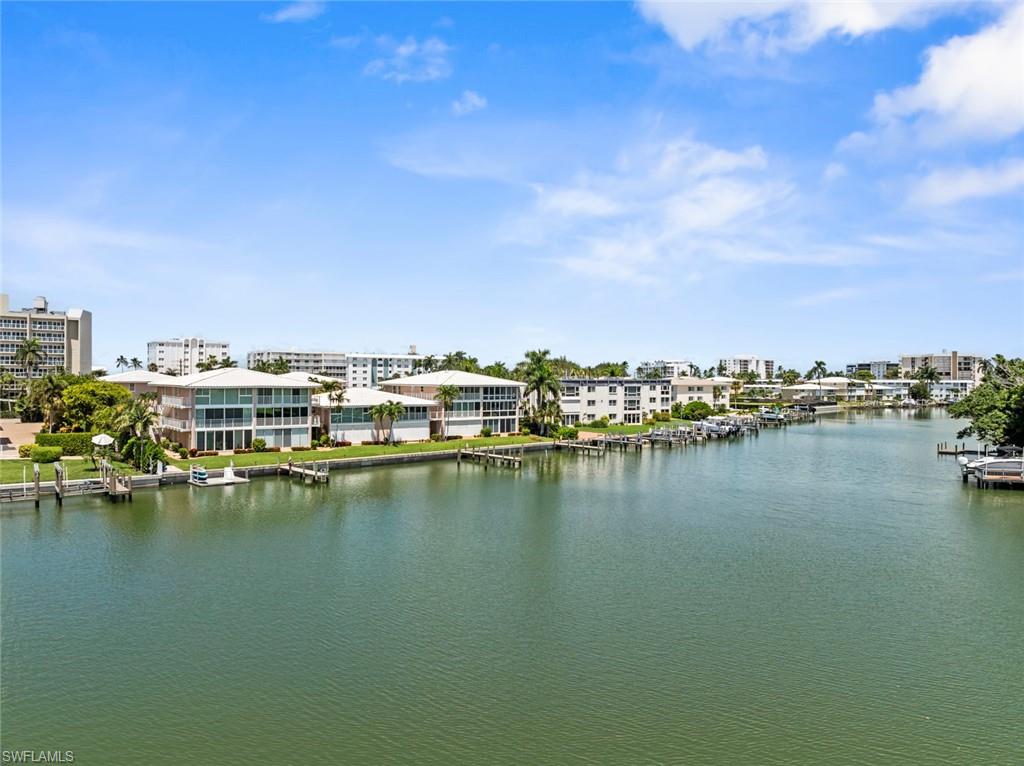 Waterfront properties featuring private docks and manicured lawns