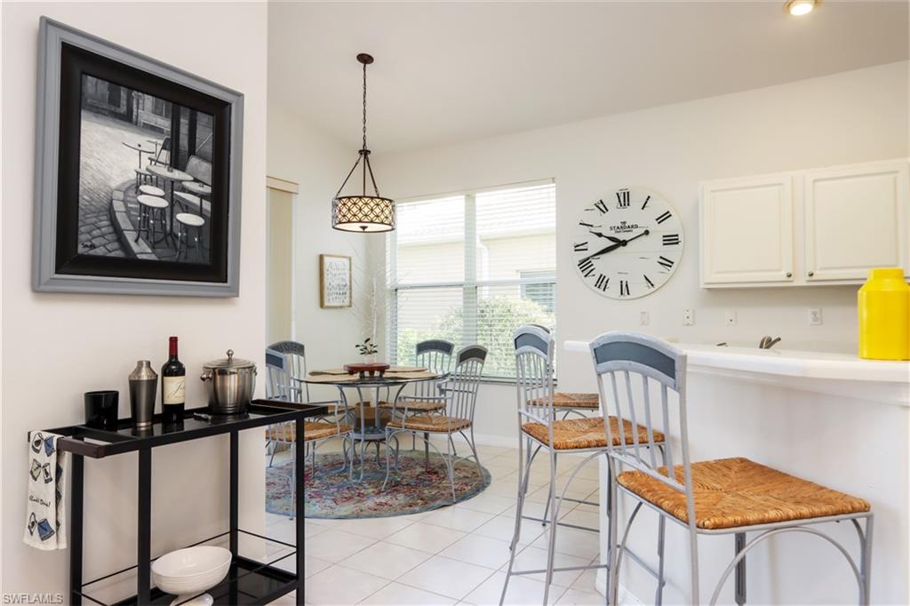 Dining room with light tile patterned flooring