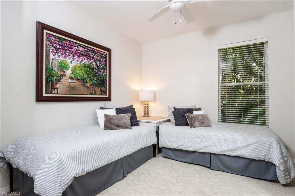 Bedroom with carpet and ceiling fan