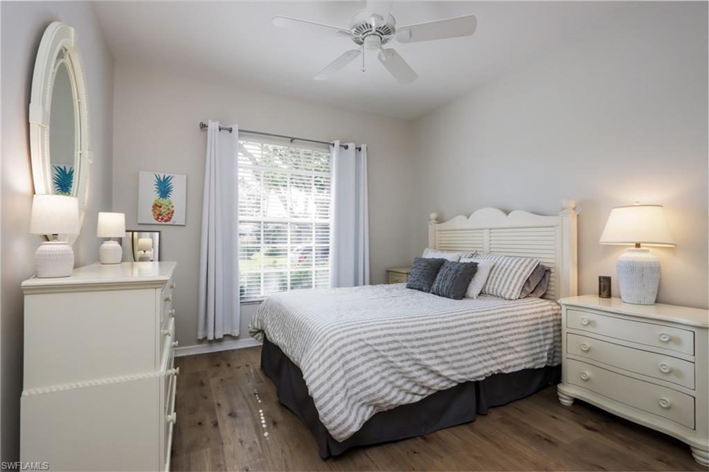 Bedroom featuring dark wood-style flooring and ceiling fan