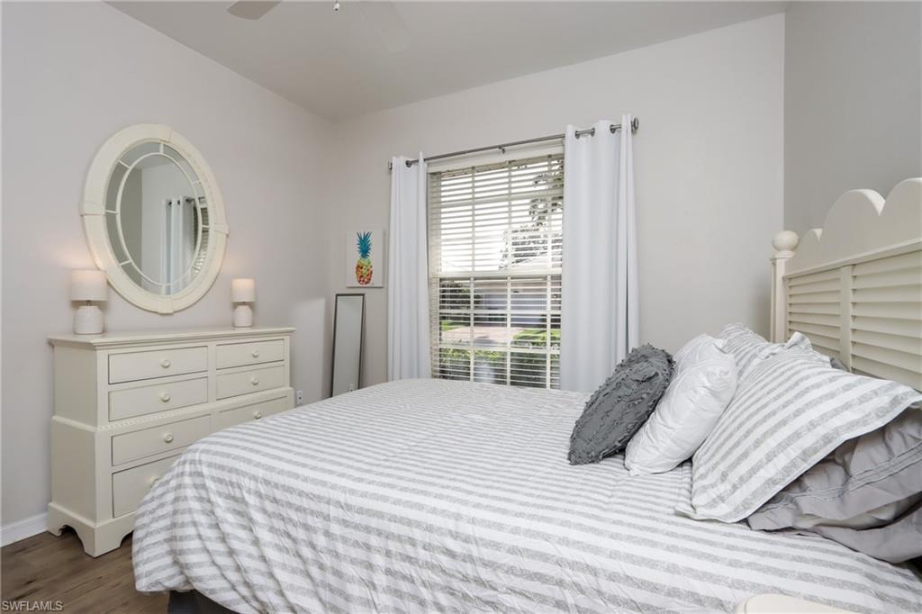 Bedroom featuring dark wood finished floors and ceiling fan