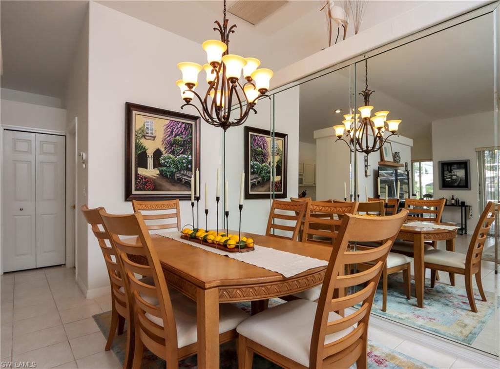 Dining room featuring a chandelier and light tile patterned floors
