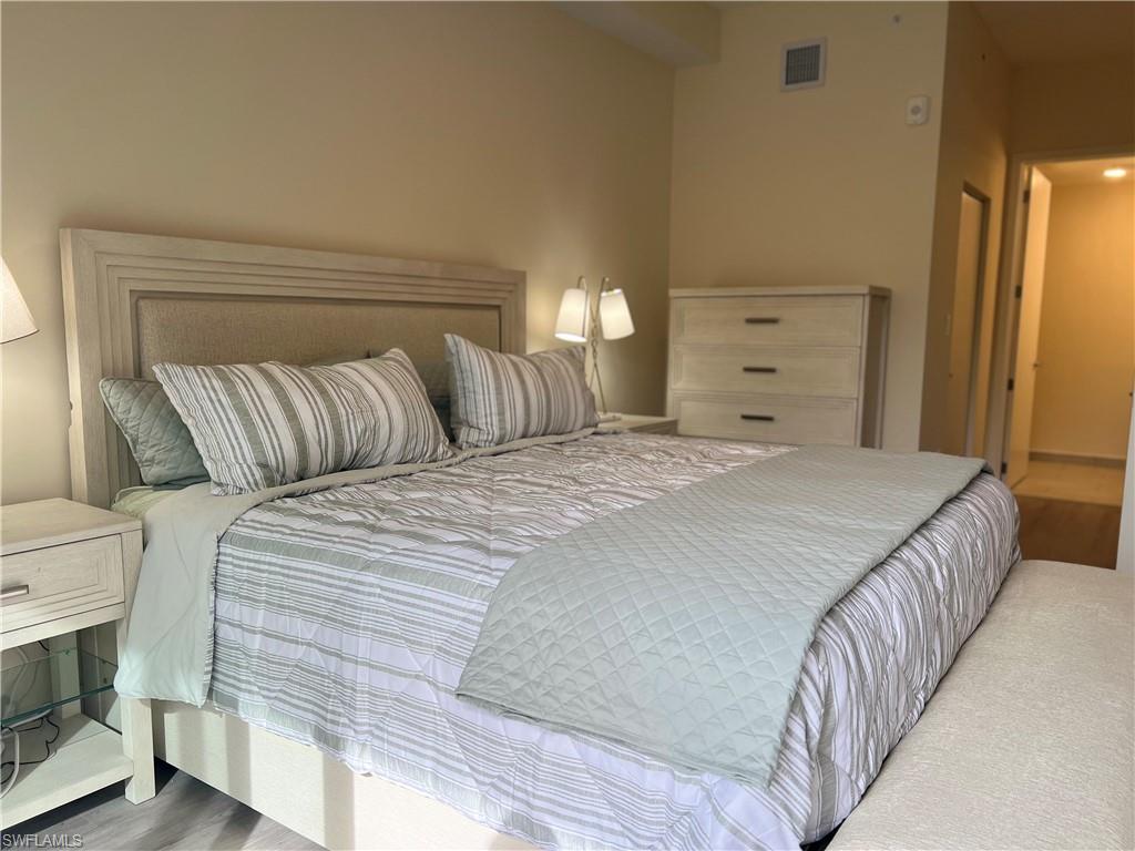 Bedroom with wood-type flooring