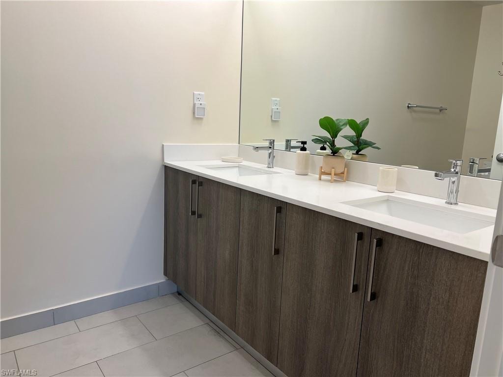 Bathroom featuring tile patterned flooring and vanity