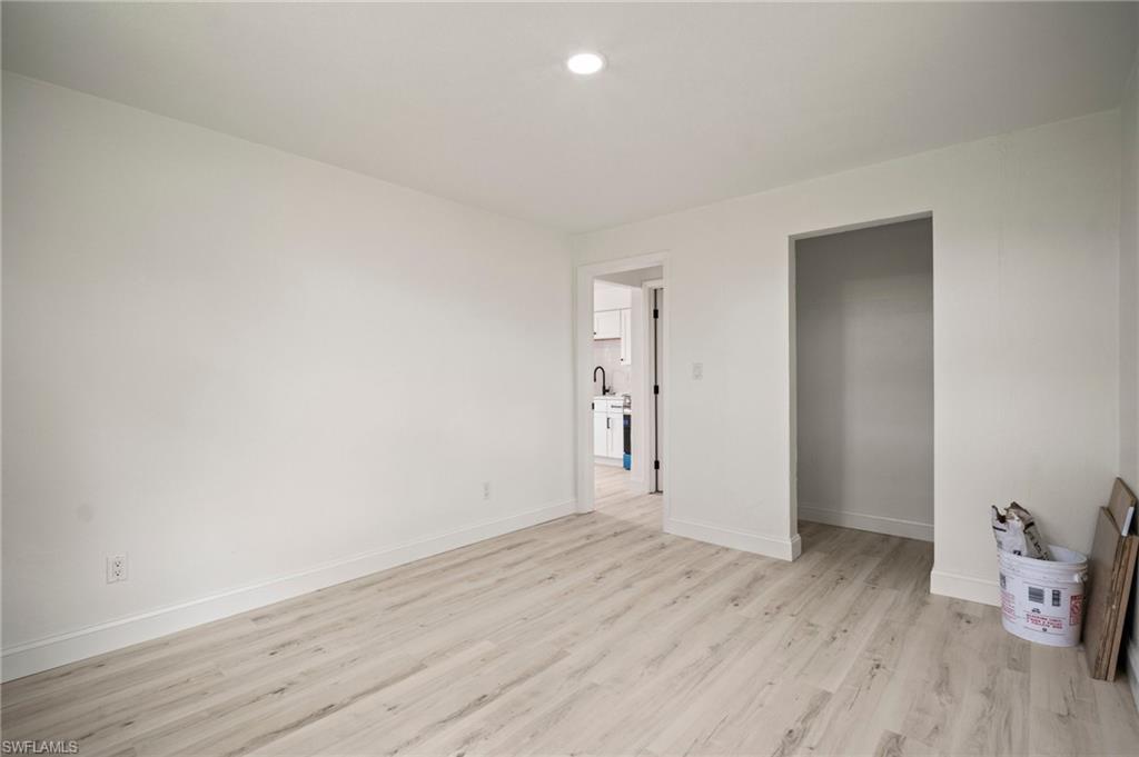 Unfurnished bedroom with light wood finished floors and recessed lighting